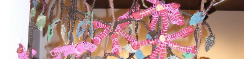 marita-dingus-detail-wall-hanging-with-pink-spiral-thingies.jpg